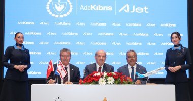 TRNC President Ersin Tatar (C) and Turkish Airlines Board of Directors and Executive Committee Chair Ahmet Bolat (R) alongside TRNC Prime Minister Ünal Üstel during the ceremony of the signing of the protocol to facilitate air transportation to TRNC, Lefkoşa (Nicosia), TRNC, July 7, 2025. (AA Photo)