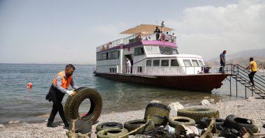 Removed car tires lie on the shore after divers retrieve them from the polluted bottom of Lake Van during an underwater cleanup near Akdamar Island, Türkiye, July 8, 2025. (AA Photo) 