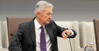 Federal Reserve Chair Jerome Powell checks his watch as he arrives to chair a Federal Reserve Board open meeting discussing proposed revisions to the board&#039;s supplementary leverage ratio standards at the Federal Reserve Board building in Washington, U.S., June 25, 2025. (AFP Photo)