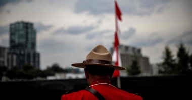 An officer of the Royal Canadian Mounted Police (RCMP) looks on during the Canada Day Celebrations in the Old Port in Montreal, Quebec, July 1, 2025. (AFP Photo)