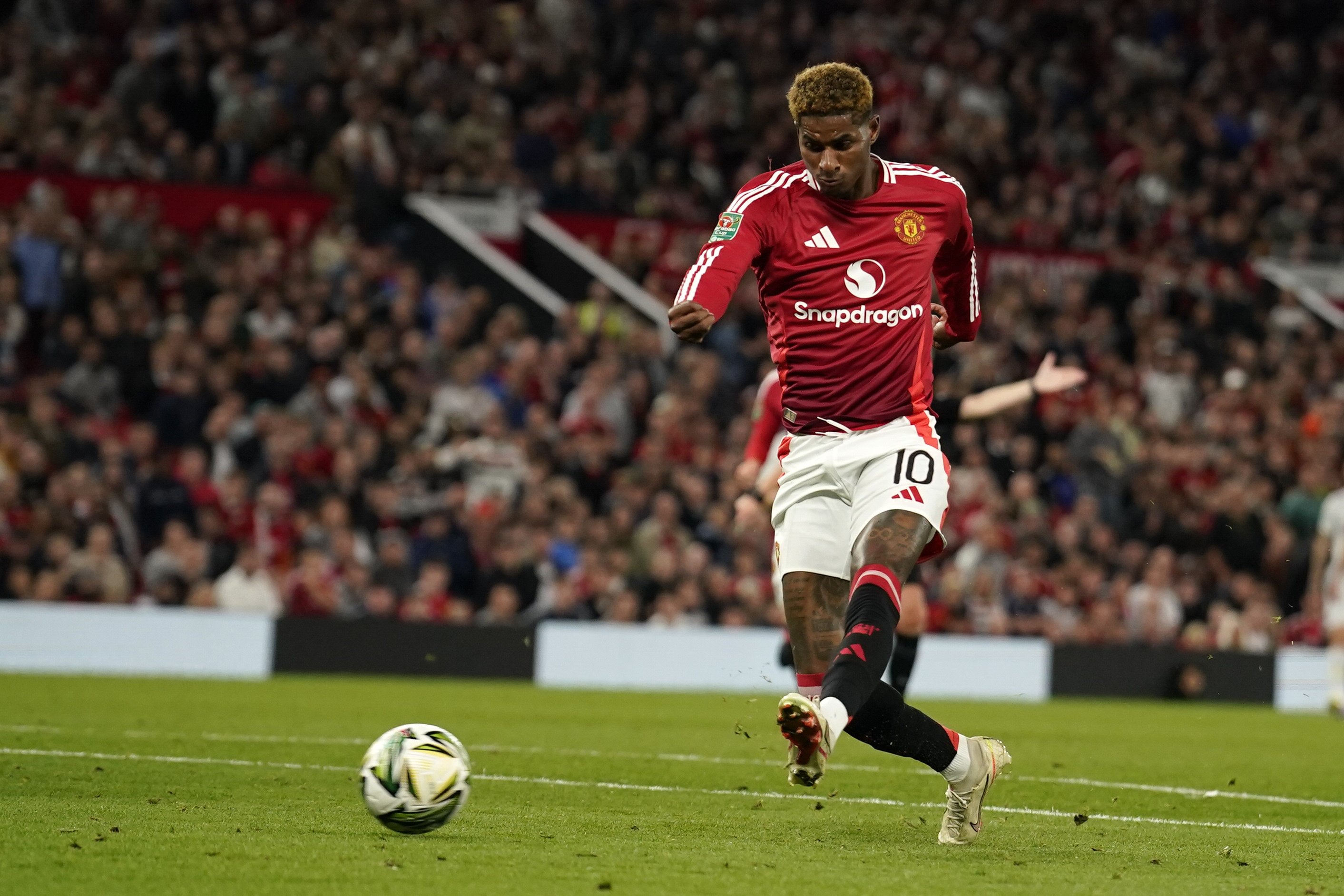 Manchester United's Marcus Rashford scores the fifth goal during the English League Cup match between Manchester United and Barnsley at Old Trafford, Manchester, U.K., Sept. 17, 2024. (AP Photo)