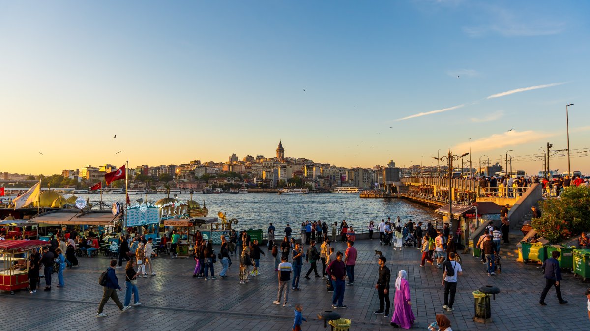 People gather along the waterfront in Eminönü to watch the sunset over the Golden Horn, Istanbul, Türkiye, May 31, 2025. (Shutterstock Photo) 