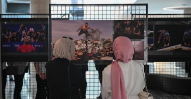 Visitors explore the Istanbul Photo Awards 2025 exhibition at CSO Ada Ankara, Ankara, Türkiye, July 8, 2025. (AA Photo)