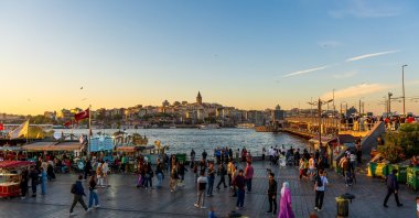 People gather along the waterfront in Eminönü to watch the sunset over the Golden Horn, Istanbul, Türkiye, May 31, 2025. (Shutterstock Photo) 