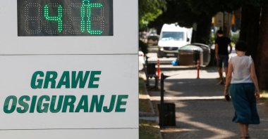 A woman passes a street thermometer showing 41 degrees Celsius as residents and tourists seek relief from scorching temperatures in the past two days, as a heat wave gripped the Balkan region, Podgorica, Montenegro, July 3, 2025. (Reuters Photo)
