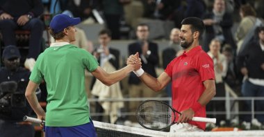 Italy&#039;s Jannik Sinner (L) and Serbia&#039;s Novak Djokovic shake hands after their semifinal match of the French Tennis Open at the Roland-Garros stadium, Paris, France, June 6, 2025. (AP Photo)