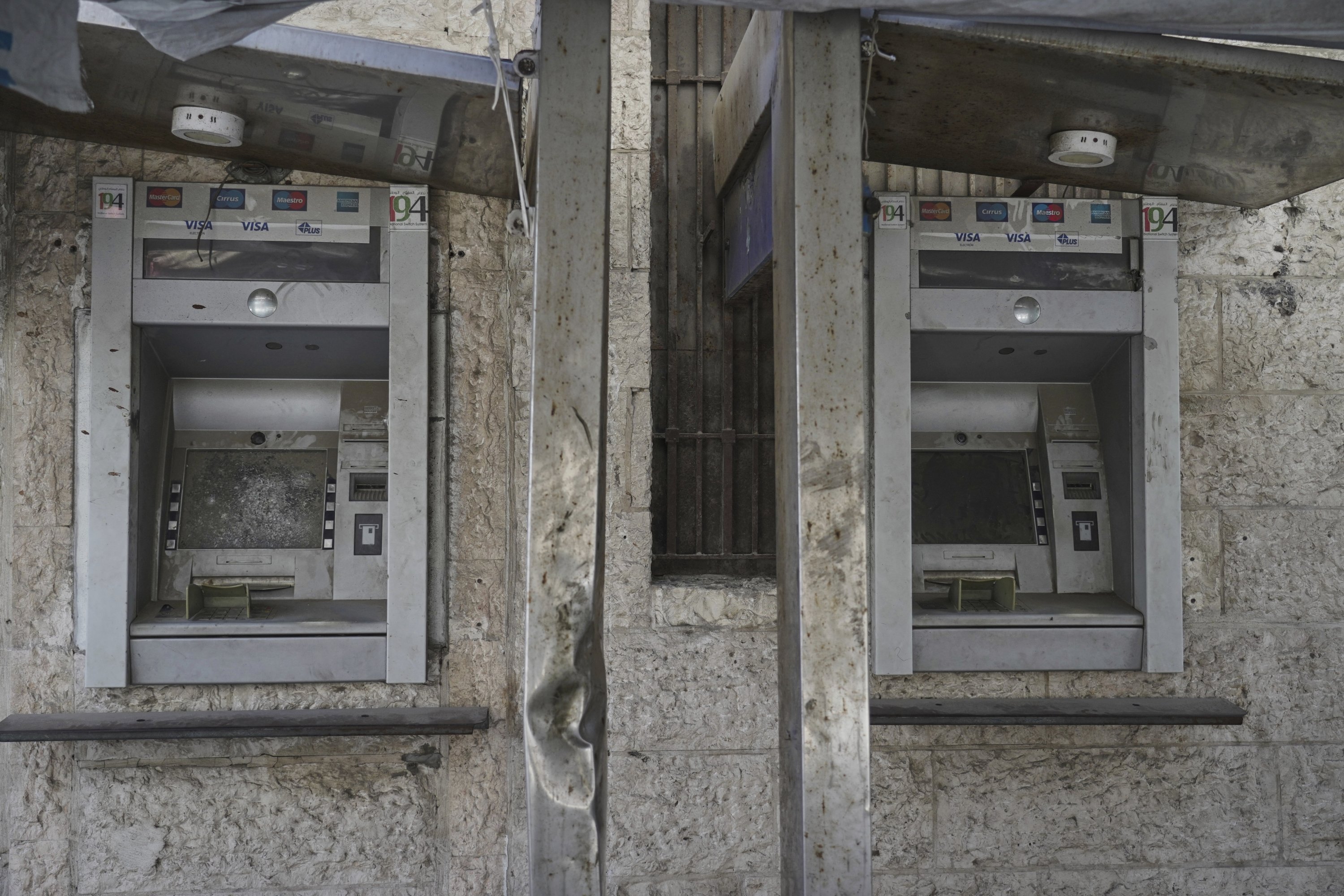 Broken Arab Bank ATMs are seen, Gaza City, Palestine, July 9, 2025. (AP Photo)