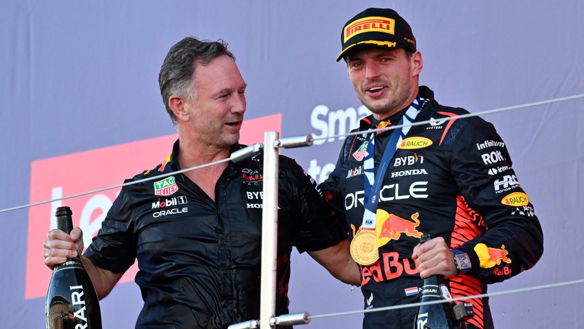 Red Bull Racing&#039;s Dutch driver Max Verstappen (R) and team principal Christian Horner (L) celebrate on the podium at the end of the Formula One Japanese Grand Prix at the Suzuka circuit, Mie prefecture, Japan, Sept. 24, 2023. (AFP Photo)