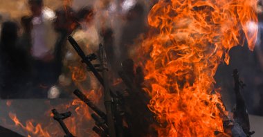 Weapons placed by PKK terrorists are burnt during their disarmament in the city of Sulaymaniyah, Iraq, July 11, 2025. (AA Photo)
