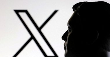 A 3D-printed miniature model of Elon Musk and the X logo is seen in this illustration taken Jan. 23, 2025. (Reuters File Photo)