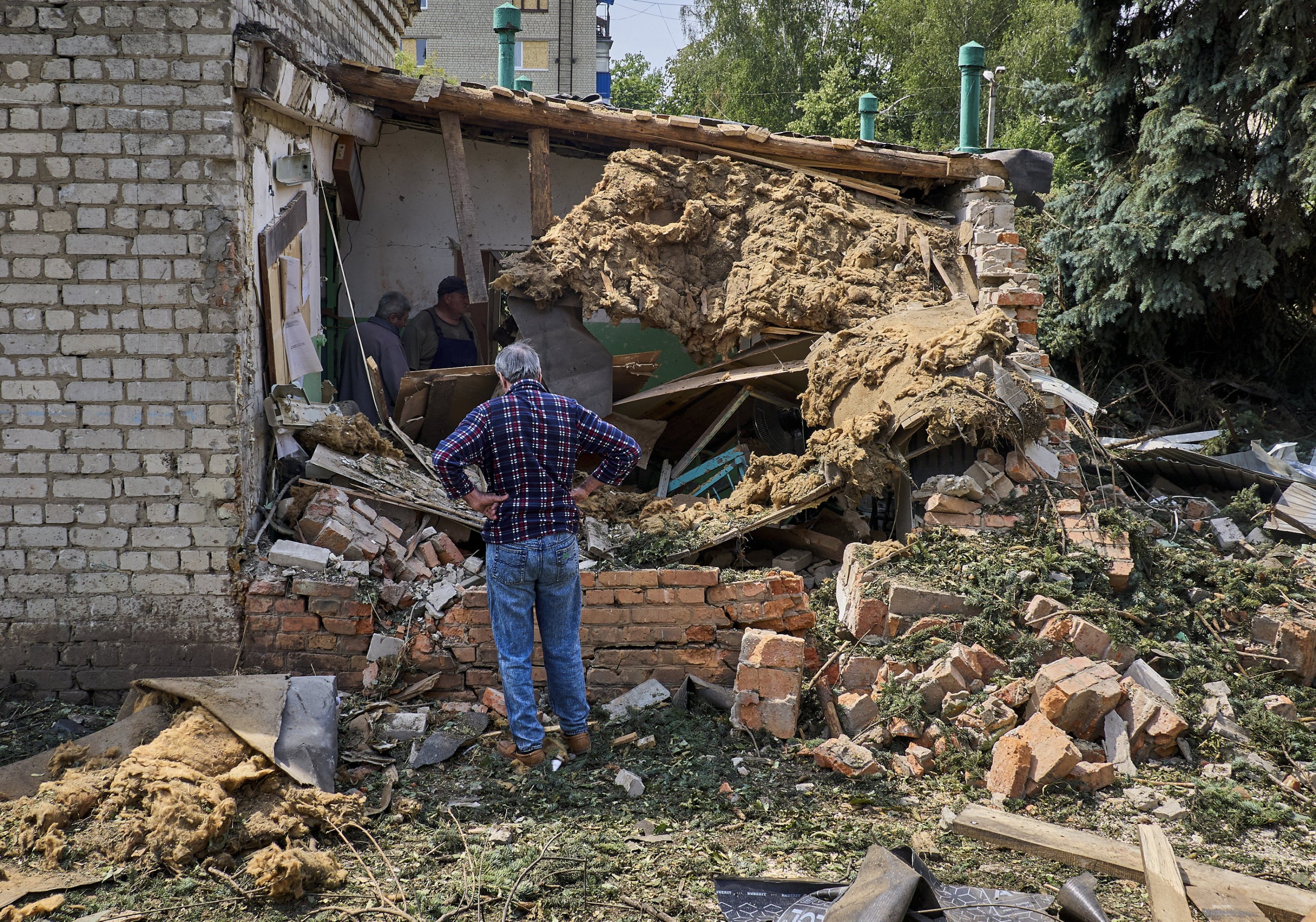 A man inspects the site of a Russian glide bomb strike, Kharkiv, Ukraine, July 12, 2025. (EPA Photo)