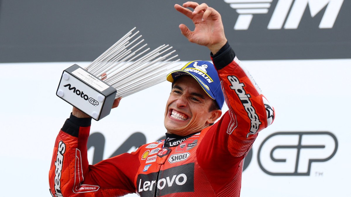 Ducati Lenovo Team&#039;s Marc Marquez celebrates on the podium with the trophy after winning German MotoGP, Sachsenring, Hohenstein-Ernstthal, Germany, July 13, 2025. (Reuters Photo)