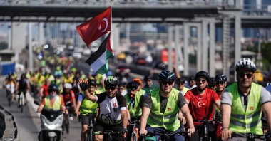 Cyclists ride across the July 15 Martyrs Bridge marking the ninth anniversary of the 2016 coup attempt, Istanbul, Türkiye, July 13, 2025. (AA Photo)