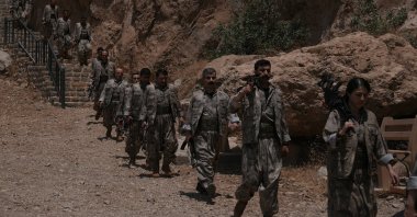 PKK members arrive for the disarmament ceremony, Sulaymaniyah, Iraq, July 11, 2025. (AA Photo)