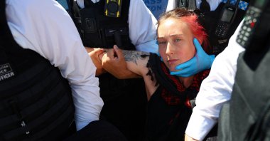 Police officers detain a protester during a demonstration calling for the de-proscription of the Palestine Action group, in Parliament Square, in London, U.K., July 12, 2025. (Reuters Photo)