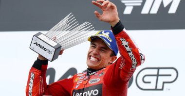 Ducati Lenovo Team&#039;s Marc Marquez celebrates on the podium with the trophy after winning German MotoGP, Sachsenring, Hohenstein-Ernstthal, Germany, July 13, 2025. (Reuters Photo)