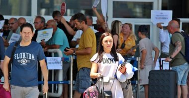 Tourists are seen exiting the airport in Antalya, southern Türkiye, July 13, 2025. (IHA Photo)