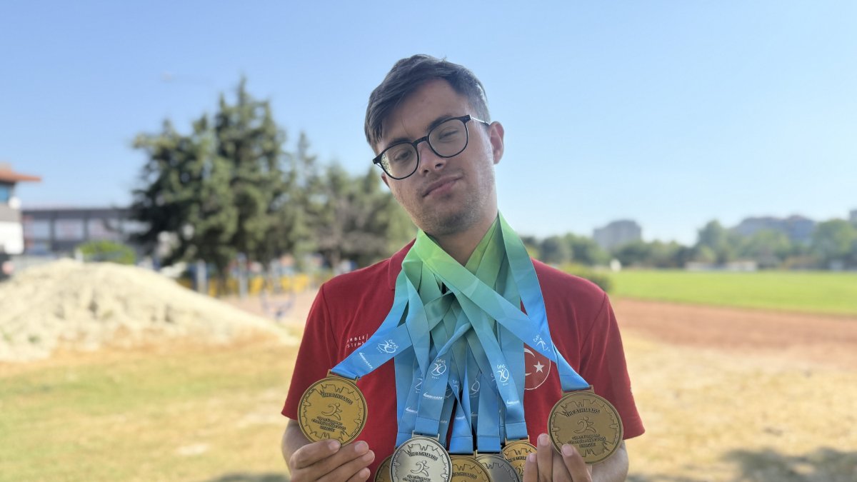 Türkiye’s Down syndrome athletics star Emirhan Akçakoca poses for a photo with his medals he won at the 2025 Down Syndrome European Championships, Tekirdağ, Türkiye, July 9, 2025. (AA Photo)
