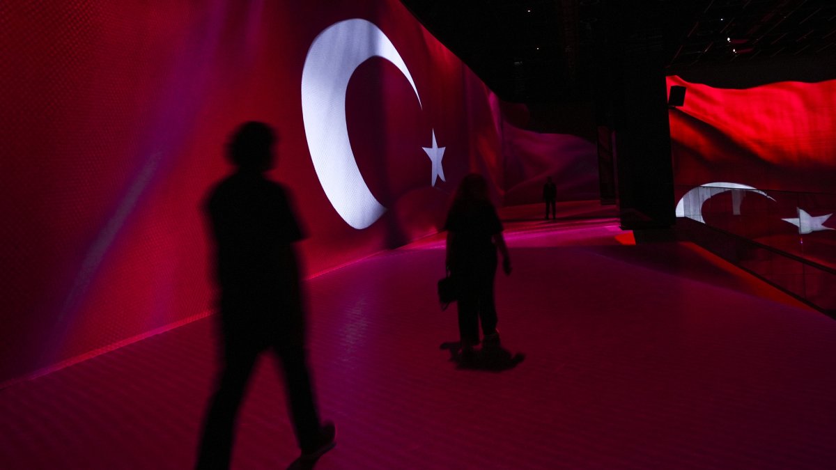 People walk by an installation featuring the Turkish flag at the 15 July Democracy Museum, Ankara, Türkiye, July 13, 2025. (AA Photo)