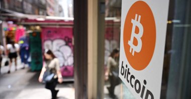 A Bitcoin sign is seen at a cryptocurrency exchange in Hong Kong, China, July 11, 2025. (AFP Photo)