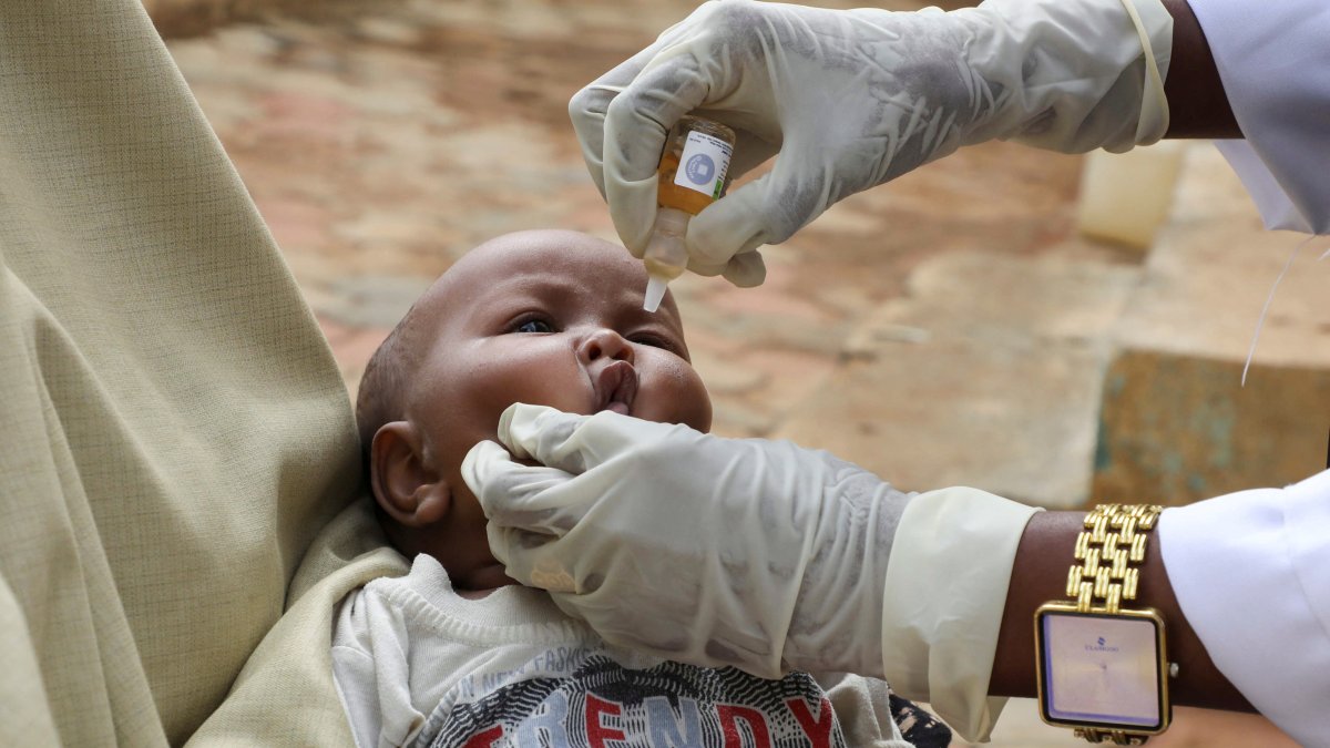 A nurse from Save the Children administers a vaccine to an internally displaced Somali child, in Baidoa, southwest Somalia, June 25, 2025. (Reuters Photo)