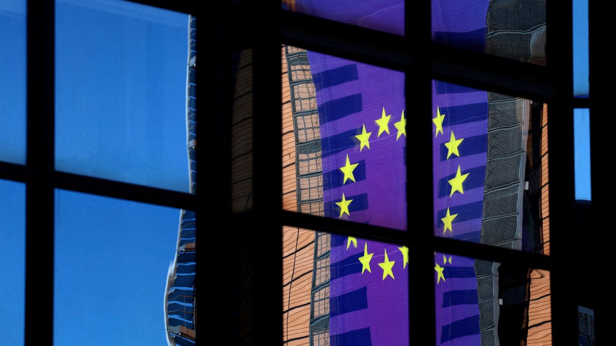 A banner depicting an European Union flag is reflected in a window outside the EU Council headquarters in Brussels, Belgium March 18, 2025. (Reuters File Photo)