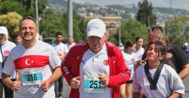 Youth and Sports Minister Osman Aşkın Bak participates in the Vatan Koşusu, Istanbul, Türkiye, July 15, 2025. (AA Photo)