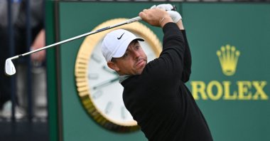 Northern Ireland&#039;s Rory McIlroy watches his 8-iron shot from the 13th tee during practice ahead of the 153rd Open Championship, Portrush, Northern Ireland, July 15, 2025. (AFP Photo)