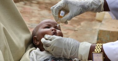 A nurse from Save the Children administers a vaccine to an internally displaced Somali child, in Baidoa, southwest Somalia, June 25, 2025. (Reuters Photo)