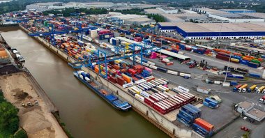An aerial view shows a container terminal at the Duisburg harbor, western Germany, July 14, 2025. (AFP Photo)