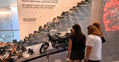 People examine the personal belongings of those who resisted the coup attempt, on display at the Memory of July 15 Museum, Istanbul, Türkiye, July 15, 2025. (AA Photo)