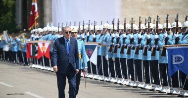 President Recep Tayyip Erdoğan salutes an honor guard as he arrives at Parliament for a remembrance ceremony, Ankara, Türkiye, July 15, 2025. (AA Photo)