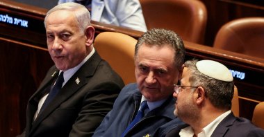 Israeli Prime Minister Benjamin Netanyahu sits in the Knesset, Israel&#039;s parliament, next to Defense Minister Israel Katz and National Security Minister Itamar Ben-Gvir on the day of a vote over possible expulsion of Ayman Odeh from parliament, in Jerusalem, July 14, 2025. (Reuters File Photo)