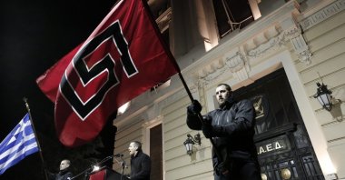 Ilias Kasidiaris lawmaker of Greece's extreme right party Golden Dawn delivers a speech during a rally in Athens on Saturday, Feb.1, 2014. (AP File Photo)