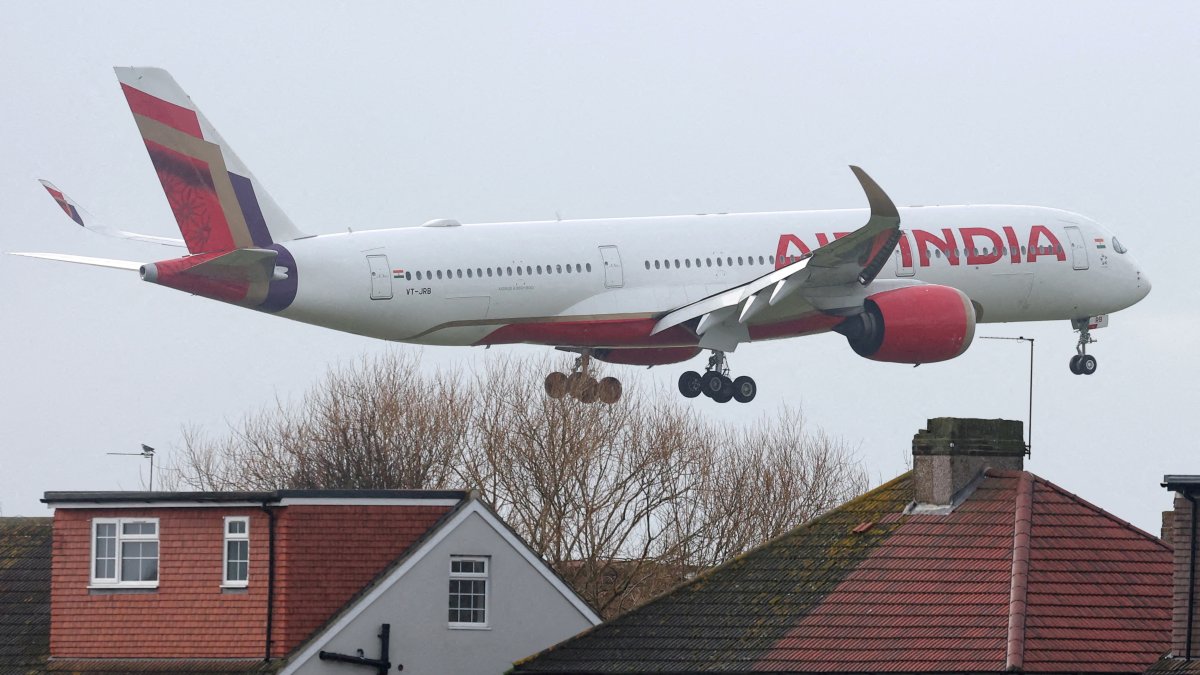 An Air India passenger plane flies near houses as it makes its landing approach to Heathrow Airport in west London, Britain, Jan. 28, 2025.  (Reuters File Photo)