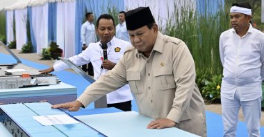 Indonesian President Prabowo Subianto holds an EV battery product during the inauguration of Southeast Asia’s largest battery industry project in Karawang, West Java, Indonesia, June 29, 2025. (Indonesian Presidential Palace Handout via AFP Photo)