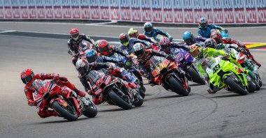 Ducati Lenovo Team&#039;s Spanish MotoGP rider Marc Marquez (L) leads the pack after the start of the race of the MotoGP German motorcycle Grand Prix at the Sachsenring racing circuit, Hohenstein-Ernstthal, Germany, July 13, 2025. (AFP Photo)