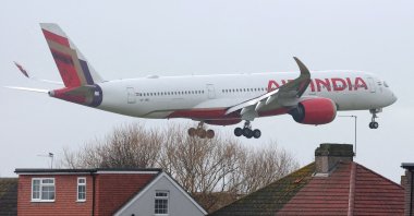 An Air India passenger plane flies near houses as it makes its landing approach to Heathrow Airport in west London, Britain, Jan. 28, 2025.  (Reuters File Photo)