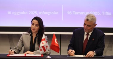Trade Minister Ömer Bolat, along with Georgian Minister of Economy and Sustainable Development Mariam Kvrivishvili, during the Türkiye-Georgia Business Forum, Tbilisi, Georgia, July 16, 2025. (AA Photo)