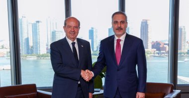 Foreign Minister Hakan Fidan shakes hands with Turkish Republic of Northern Cyprus (TRNC) President Ersin Tatar, New York, U.S., July 16, 2025 (AA Photo)
