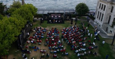 Lead actor Ahmet Kural, screenwriter and director Sümeyye Karaaslan and actor Hande Soral speak at a TRT 12 Punto event for the "Gassal" series at Feriye, Istanbul, Türkiye, July 14, 2025. (AA Photo)
