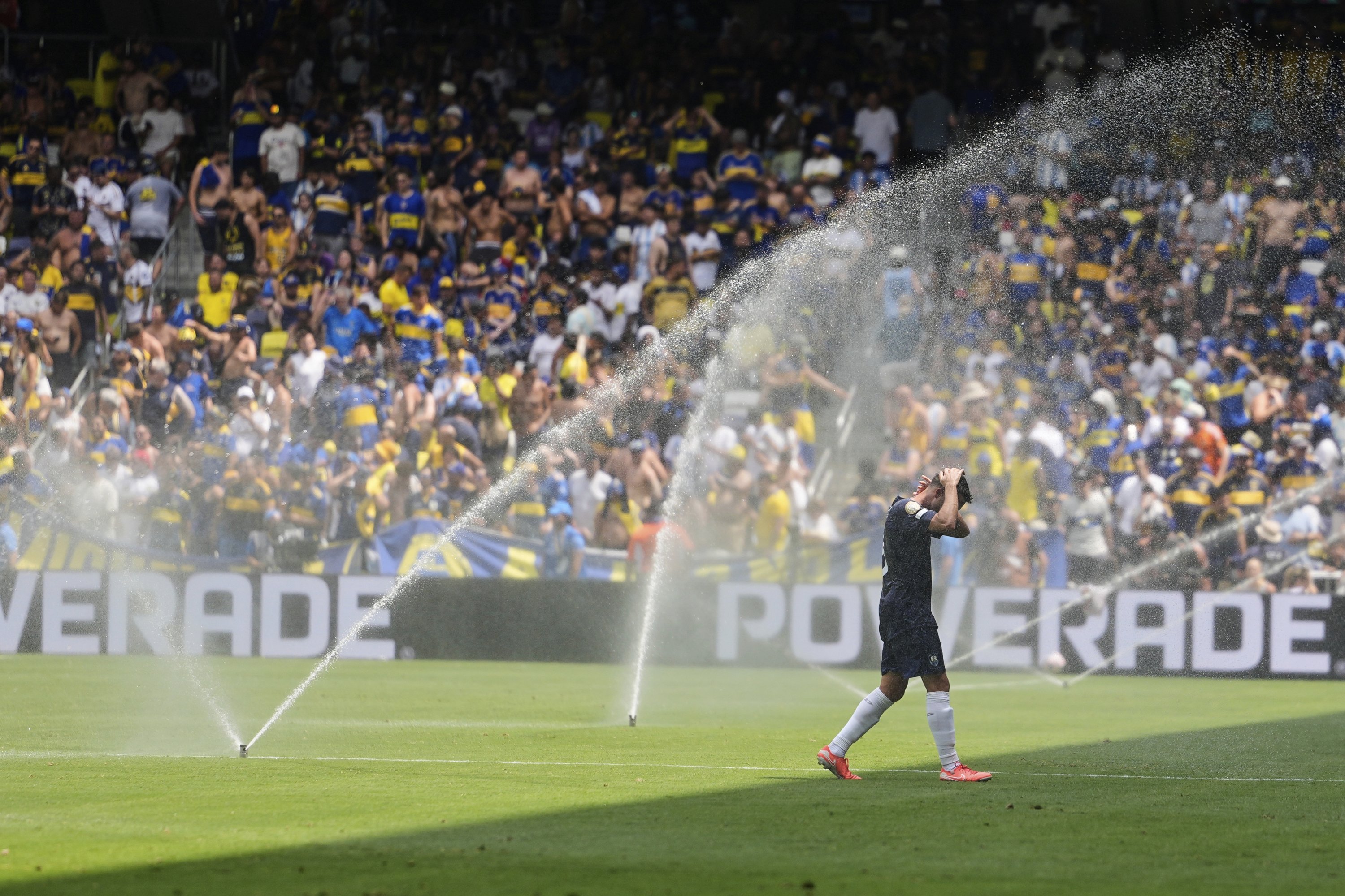 Auckland City's Gerard Garriga cools off under the sprinklers during a water break in the Club World Cup Group C match between Auckland City and Boca Juniors, Nashville, U.S., June 24, 2025. (AP Photo)