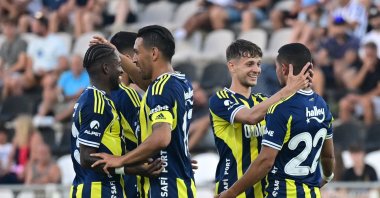 Fenerbahçe players celebrate following Sebastian Szymanski&#039;s (2nd R) goal during a friendly match against Portimonense at the Estadio Municipal de Albufeira, Albufeira, Portugal, July 17, 2025. (AA Photo)
