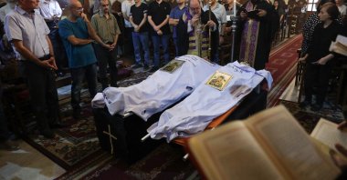 Archbishop Alexios blesses the bodies of Saad Salameh and Foumia Ayyad, killed earlier in an Israeli strike that hit the Holy Family church, Gaza City, Palestine, July 17, 2025. (AFP Photo)