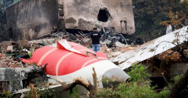 A firefighter stands next to the crashed Air India Boeing 787-8 Dreamliner aircraft, Ahmedabad, India, June 13, 2025. (Reuters Photo)