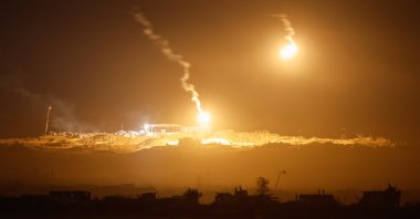 Flares fired by Israel Defense Forces light up the sky above Gaza, as seen from the Israeli side of the border, July 17, 2025. (Reuters Photo)
