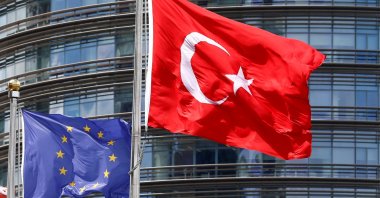 A European Union (L) and Turkish flag fly outside a hotel in Istanbul, Türkiye, May 4, 2016. (Reuters Photo)
