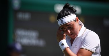 Tunisia&#039;s Ons Jabeur reacts as she plays against Bulgaria&#039;s Viktoriya Tomova during their women&#039;s singles first round tennis match on the first day of the 2025 Wimbledon Championships at The All England Lawn Tennis and Croquet Club, Wimbledon, London, U.K., June 30, 2025. (AFP Photo)