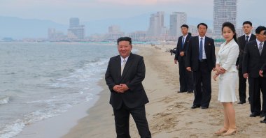 North Korean leader Kim Jong Un (L) and his daughter Kim Ju Ae (3rd R) stand on a beach during a ceremony marking the opening of the Wonsan Kalma Coastal Tourist Zone, Wonsan, North Korea, June 24, 2025. (EPA Photo)