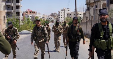 Syrian security forces walk together along a street, after clashes between Syrian government troops and local Druze fighters resumed, Suwayda, Syria, July 16, 2025. (Reuters Photo)